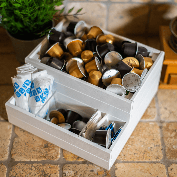 Drawer organiser filled with coffee pods and capsules